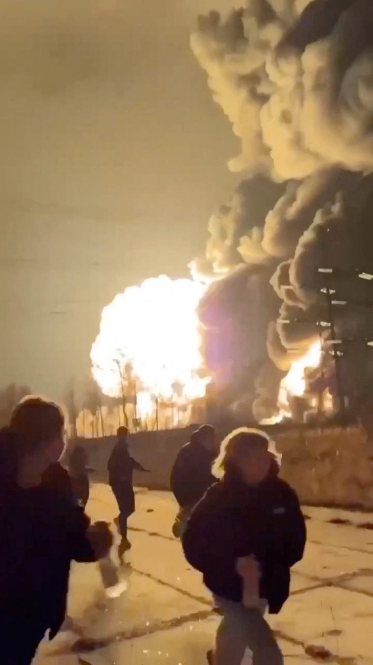People run as smoke rises from an explosion during what the governor of Russia's Ryazan region southeast of Moscow describes as an air attack, in Ryazan, Ryazan Region, Russia in this still image obtained from social media video released January 24, 2025. Social Media/via REUTERS THIS IMAGE HAS BEEN SUPPLIED BY A THIRD PARTY. NO RESALES. NO ARCHIVES. NEWS USE ONLY. TPX IMAGES OF THE DAY