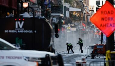 Workers clean the street at the site where people were killed by a man driving a truck in an attack during New Year's celebrations, in New Orleans, Louisiana, US.