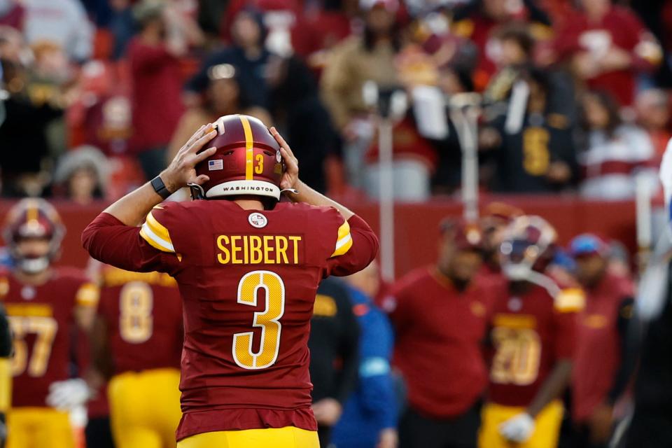 Washington Commanders place kicker Austin Seibert (3) reacts after missing a potential game-tying extra point in the final minute against the Dallas Cowboys during the fourth quarter at Northwest Stadium. Mandatory Credit: Geoff Burke-Imagn Images