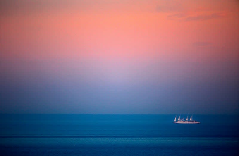 A cruise ship cruises the Mediterranean off the coast of Nice, southeastern France, during the sunset, Friday, May 6, 2016. | Lionel Cironneau