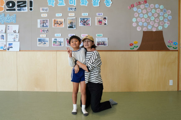 Kim Myongae (right), 37, lawyer, a former student at the Aichi Korean Middle and High School with her son who is enrolled at the local Korean primary school. 