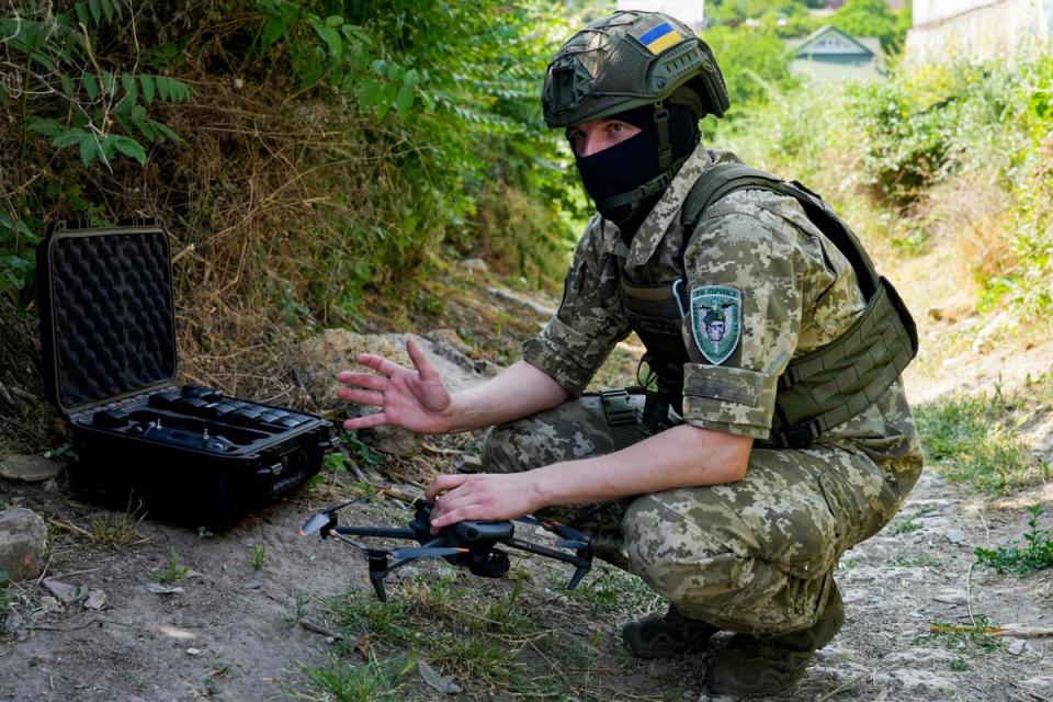 A Ukrainian serviceman operates the DJI Mavic 3 drone, the sort of unit used for drone swarm operations (AFP via Getty Images)
