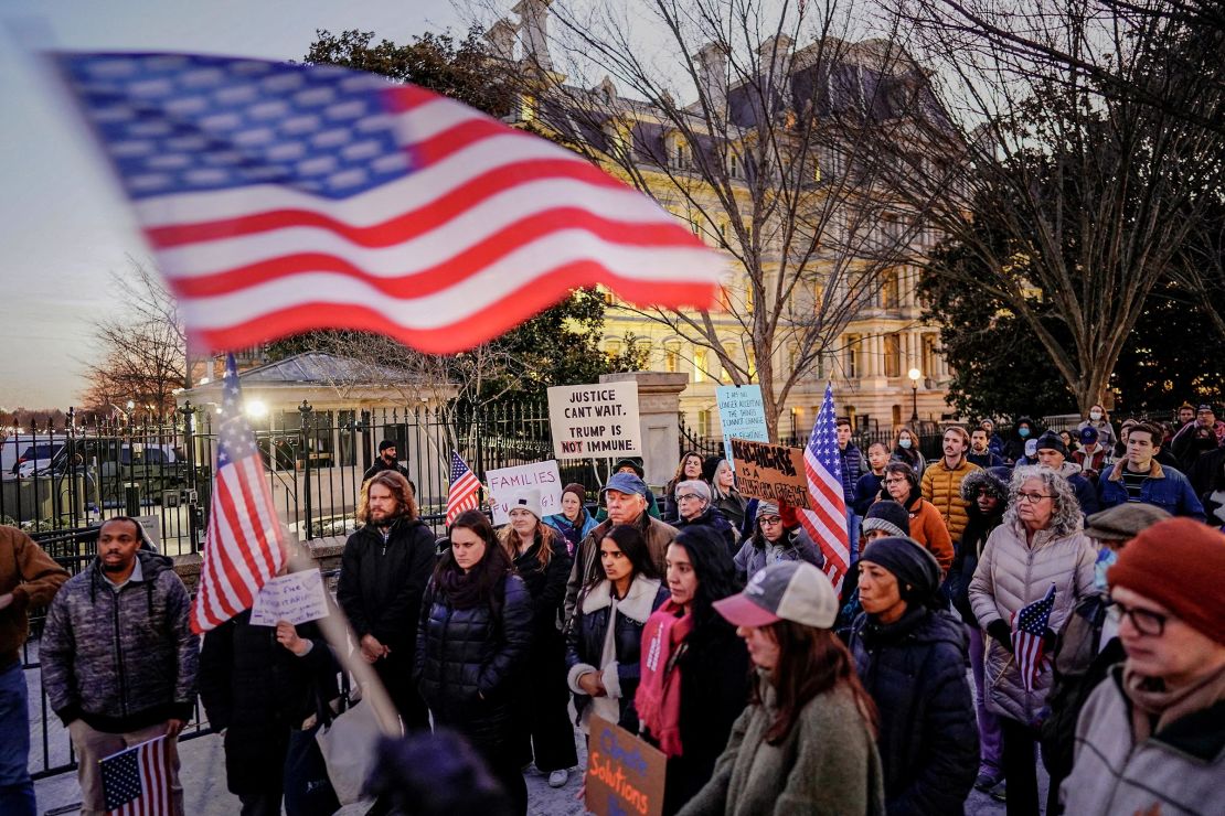 People gather during a rally in support of federal funding and in opposition to President Donald Trump's order to pause all federal grants and loans, near the White House in Washington, DC, on January 28. 
