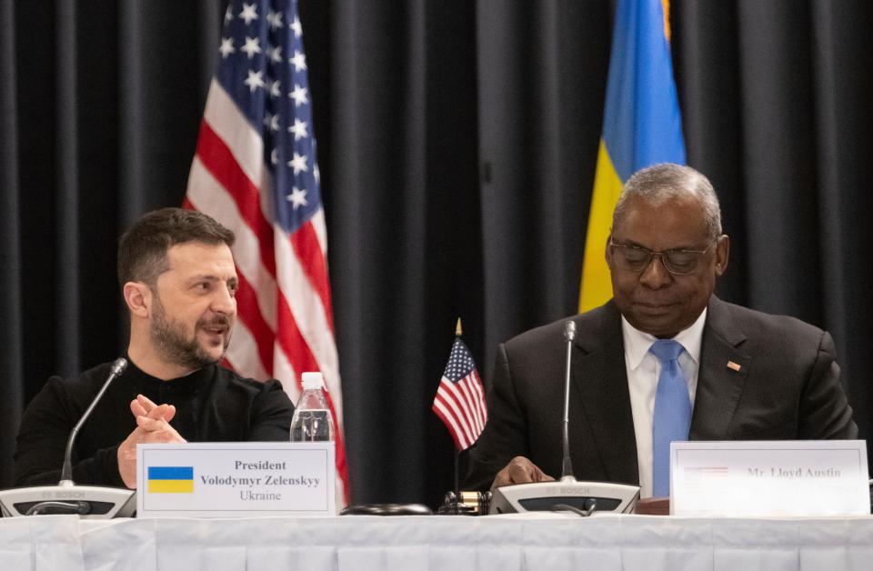 Ukrainian president Volodymyr Zelensky sits next to US defence secretary Lloyd Austin III at the Ramstein air base, Germany (AP)