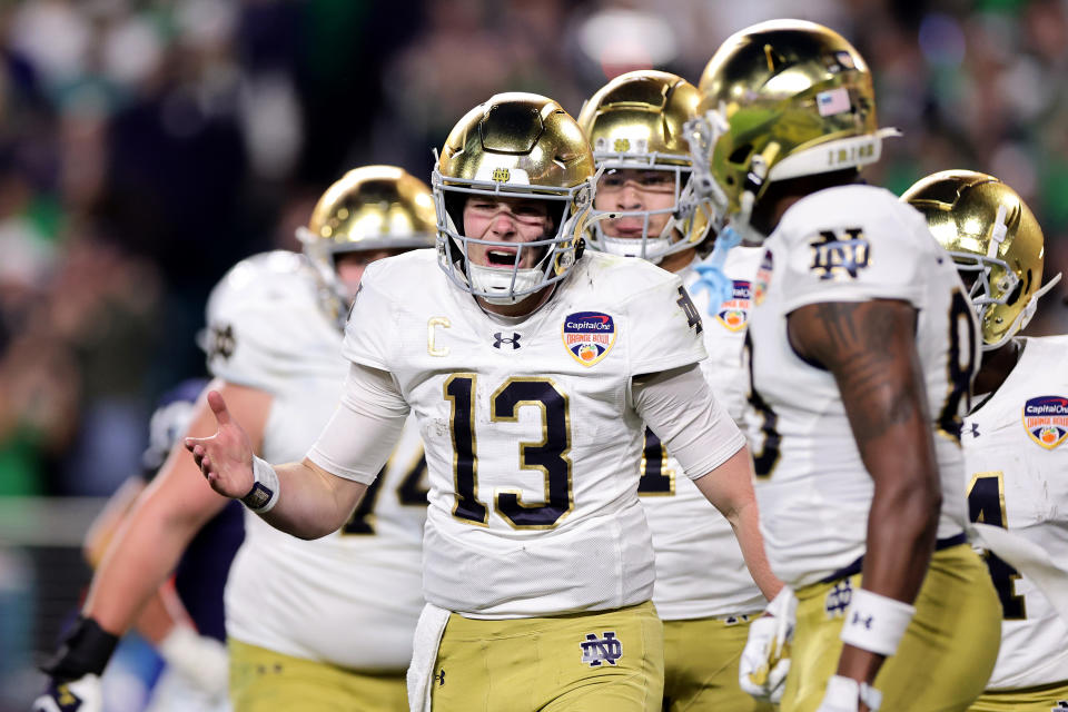 MIAMI GARDENS, FLORIDA - JANUARY 09: Riley Leonard #13 of the Notre Dame Fighting Irish celebrates with teammates after running the ball for a touchdown during the third quarter against the Penn State Nittany Lions in the Capital One Orange Bowl at Hard Rock Stadium on January 09, 2025 in Miami Gardens, Florida. (Photo by Carmen Mandato/Getty Images)