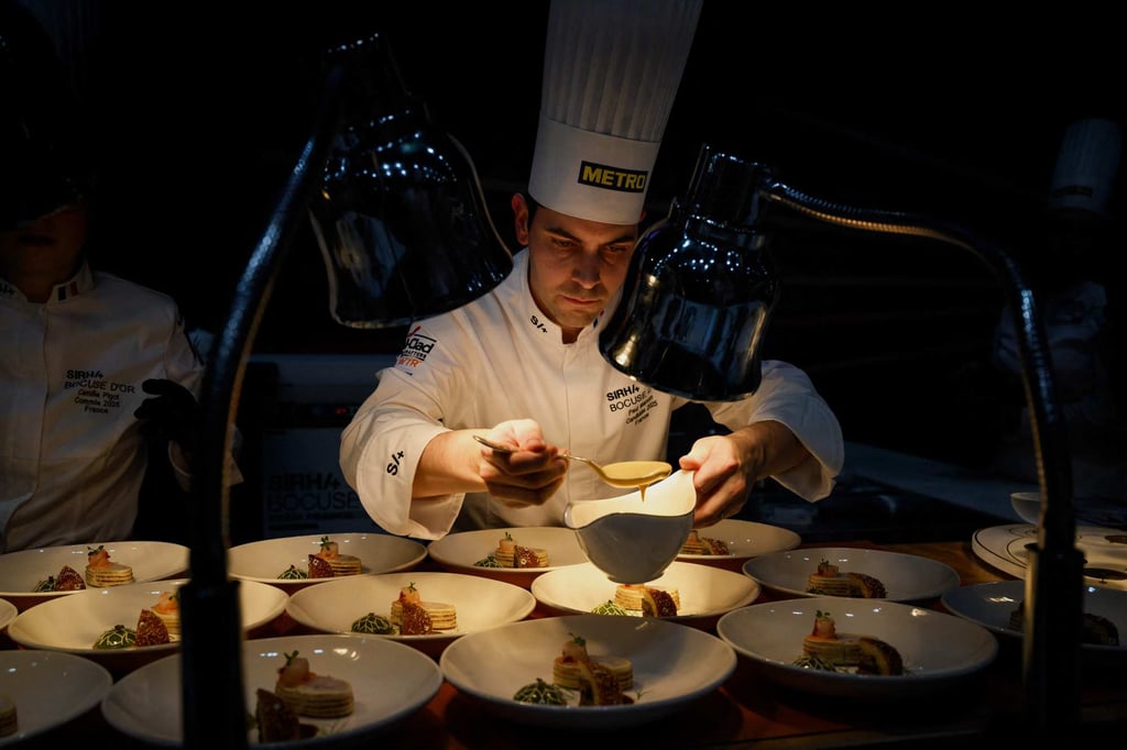 Marcon prepares dishes as he competes in the 2025 Bocuse d’Or cooking competition. Photo: AFP Marcon prepares dishes as he competes in the 2025 Bocuse d’Or cooking competition. Photo: AFP