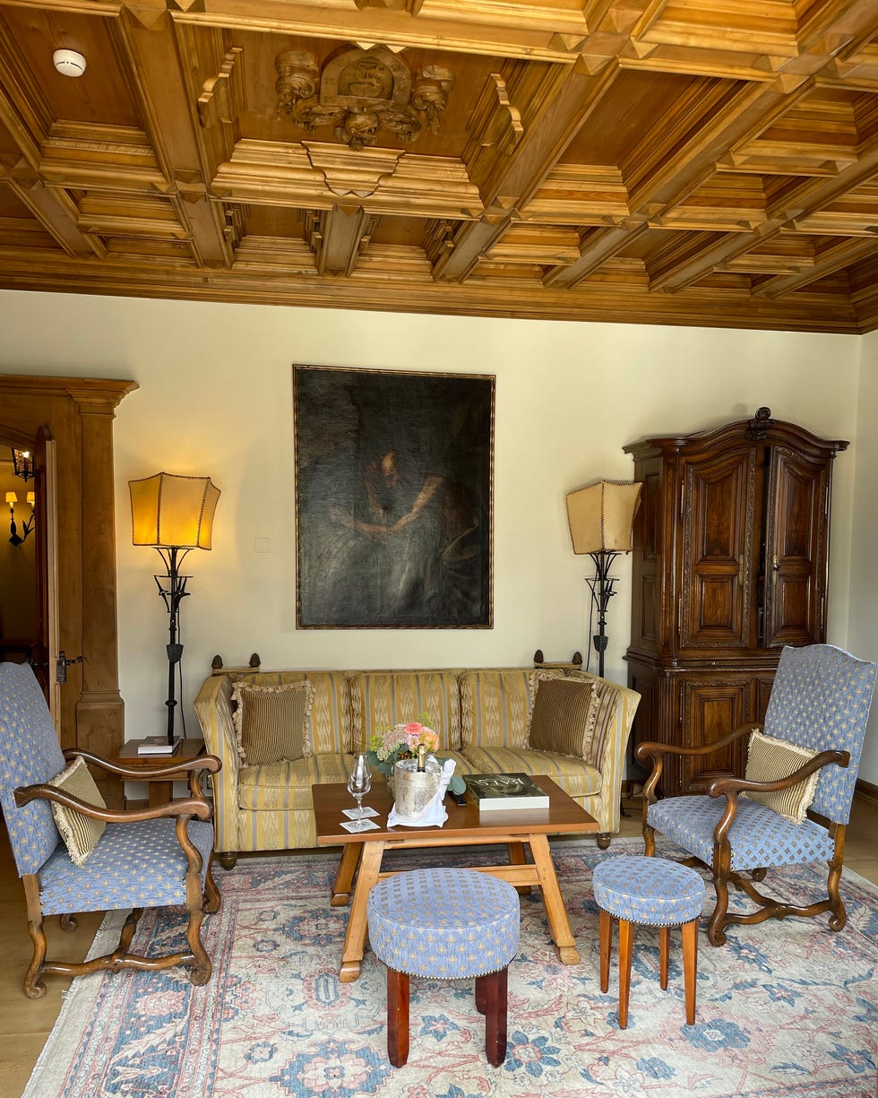 the hitchcock suite living room features an intricate woodpaneled ceiling
