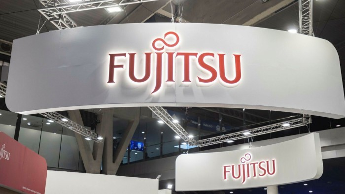 A show display booth with a Fujitsu logo on it