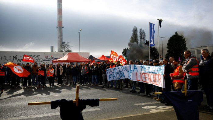 Michelin workers protest in front of a Michelin plant in France