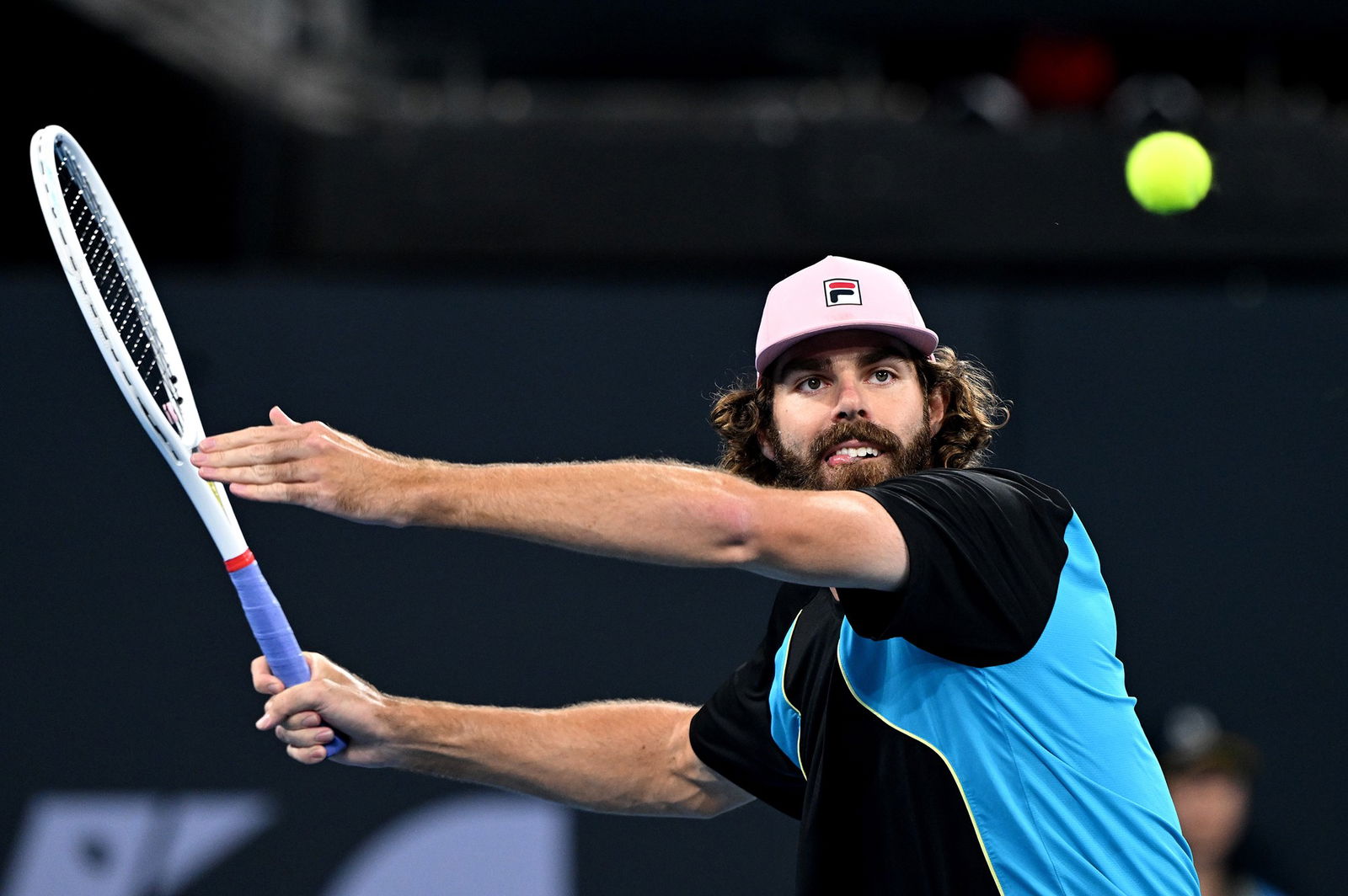 Reilly Opelka prepares to play a forehand.
