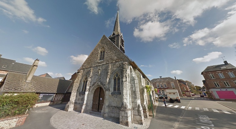 Stone church with a steeple in the small French town of Lieurey, Thiberville in Normandy, which received a large bequest.