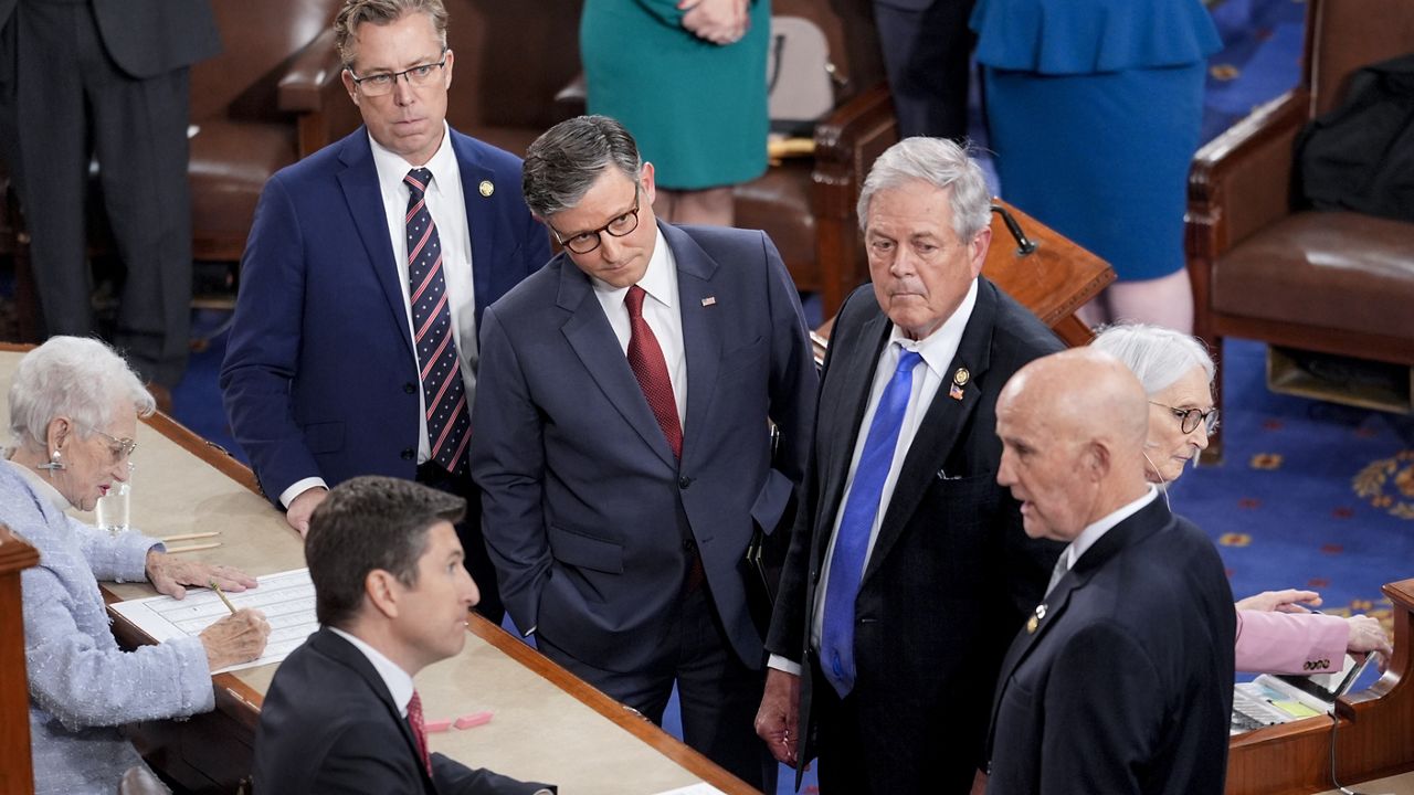 Speaker of the House Mike Johnson, R-La., third right, stands with with conservative Republican members, from left, Rep. Andy Ogles, R-Tenn., Rep. Ralph Norman, R-S.C., and Rep. Keith Self, R-Texas, as the Freedom Caucus members agree to change their vote in favor of Johnson to stay on as speaker, as the House of Representatives convenes the new 119th Congress with a slim Republican majority, at the Capitol in Washington, Friday, Jan. 3, 2025. (AP Photo/J. Scott Applewhite)