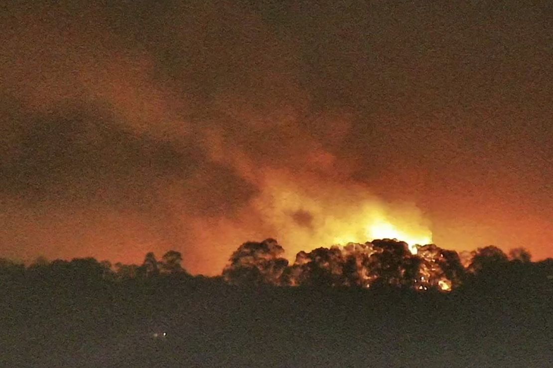 Flames from a fire at the Moss Landing Power Plant are seen Thursday night.