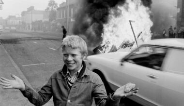 1978: Youth with a stone during a riot at the top of Leeson Street, west Belfast, N Ireland.