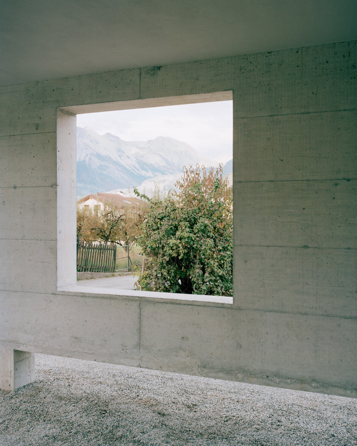 lionel ballmer architectes' charred wood house echoes traditional barns of rural switzerland