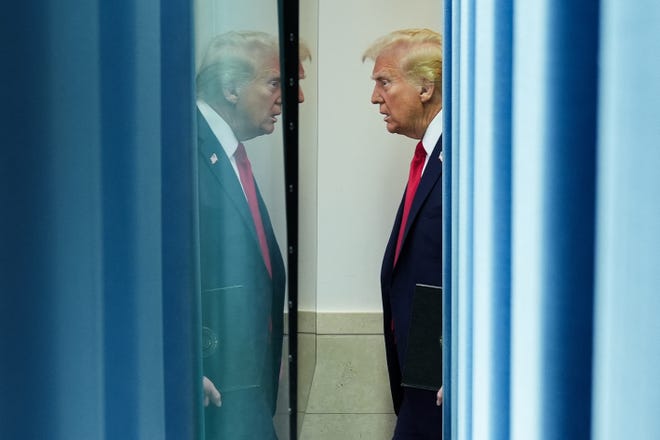President Donald Trump arrives in the White House briefing room on Jan. 30, 2025, to speak about the mid-air crash between American Airlines flight 5342 and a military helicopter in Washington.