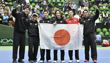 Japan celebrate their qualifying win over Britain in Miki (STR)