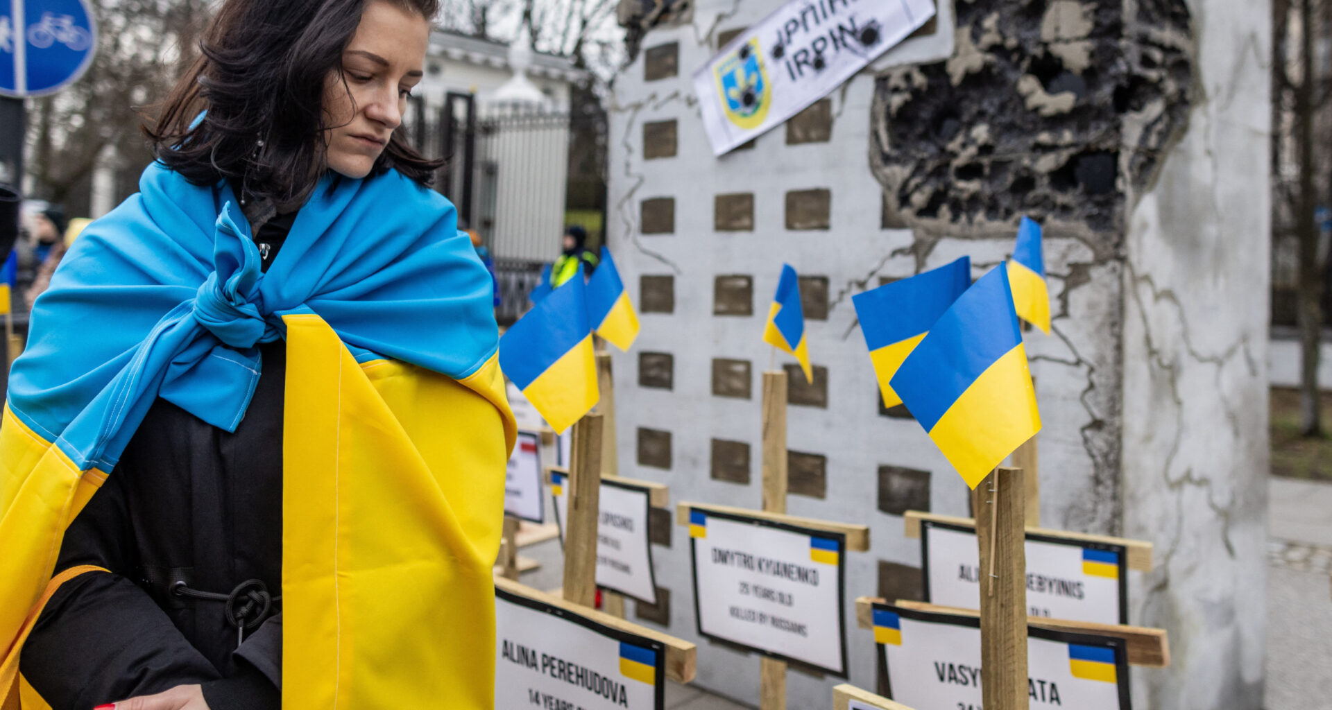 Woman in Ukrainian flag Warsaw