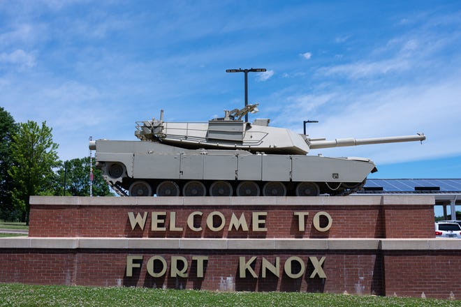 An M1 Abrams tank sits on a pedestal above the entrance signage to Fort Knox, a US military installation, on May 31, 2021 in Fort Knox, Kentucky.