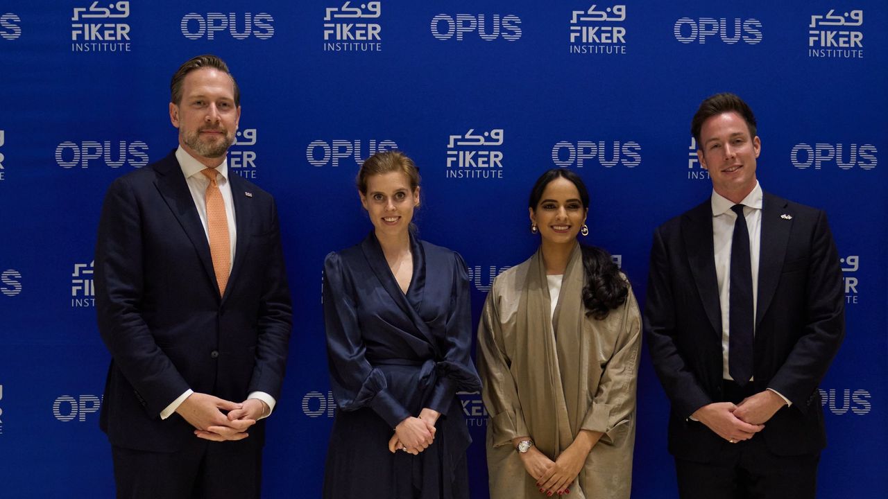Princess Beatrice rewears the romantic navy gown from her engagement portraits during a conference in Dubai