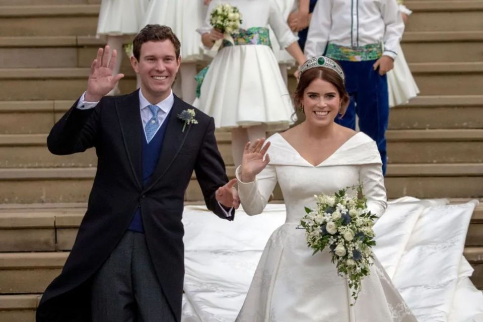 Princess Eugenie and James Brooksbank waving after their wedding.
