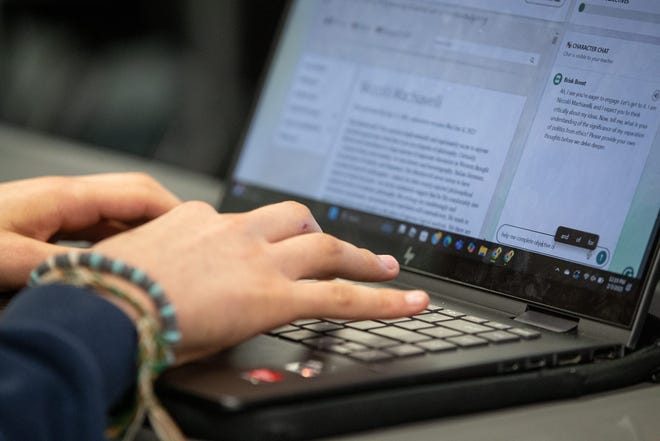Osiel Salazar responds to an artificial intelligence prompt for an assignment during a 10th grade English class at Collegiate High School on Feb. 3, 2025, in Corpus Christi, Texas.