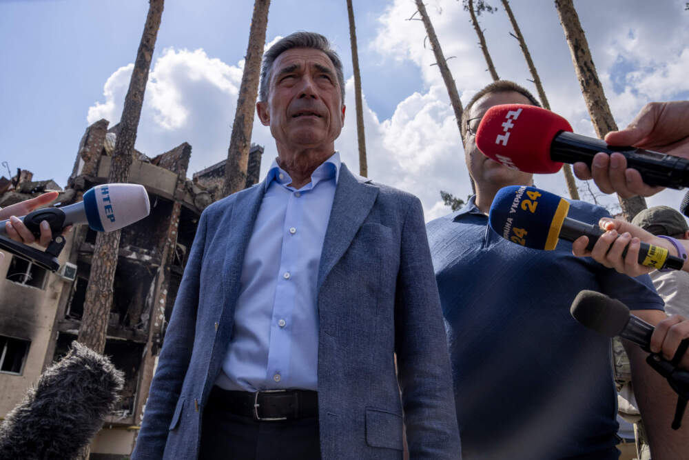Former Secretary General of NATO Anders Fogh Rasmussen speaks to the press, during his visit to Irpin, on the outskirts of Kyiv, Ukraine, Friday, July 1, 2022. (Nariman El-Mofty/AP)