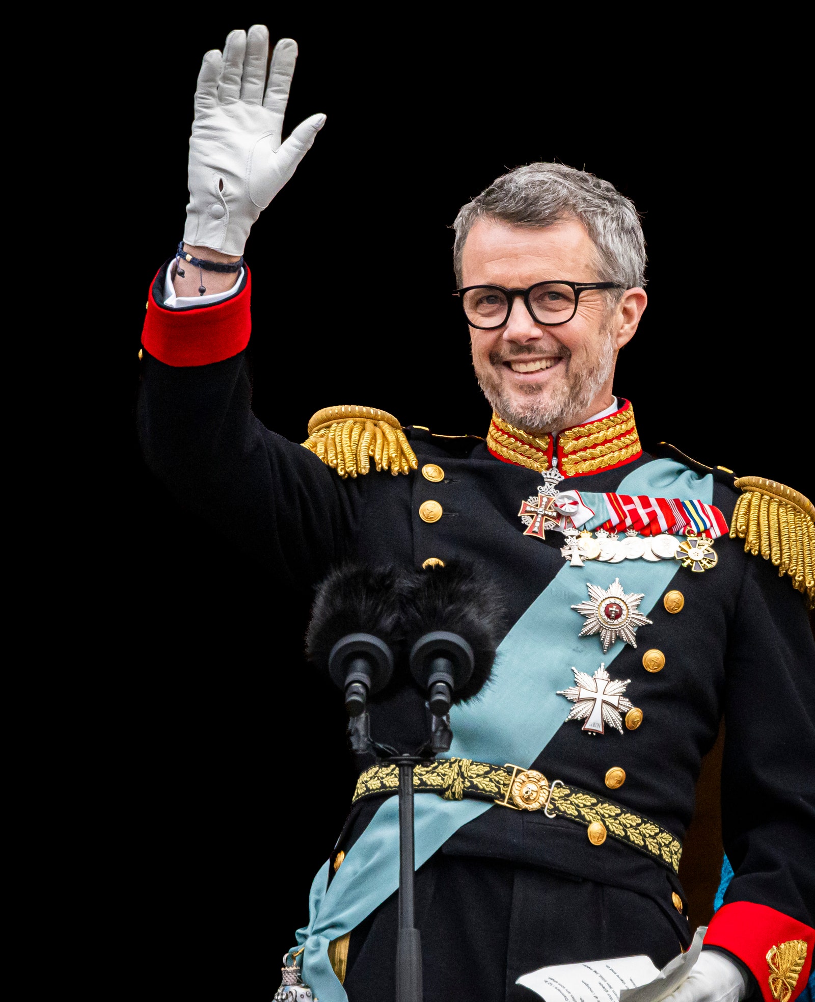 Image may contain Clothing Glove Person Adult Accessories Glasses Electrical Device Microphone Officer and Military