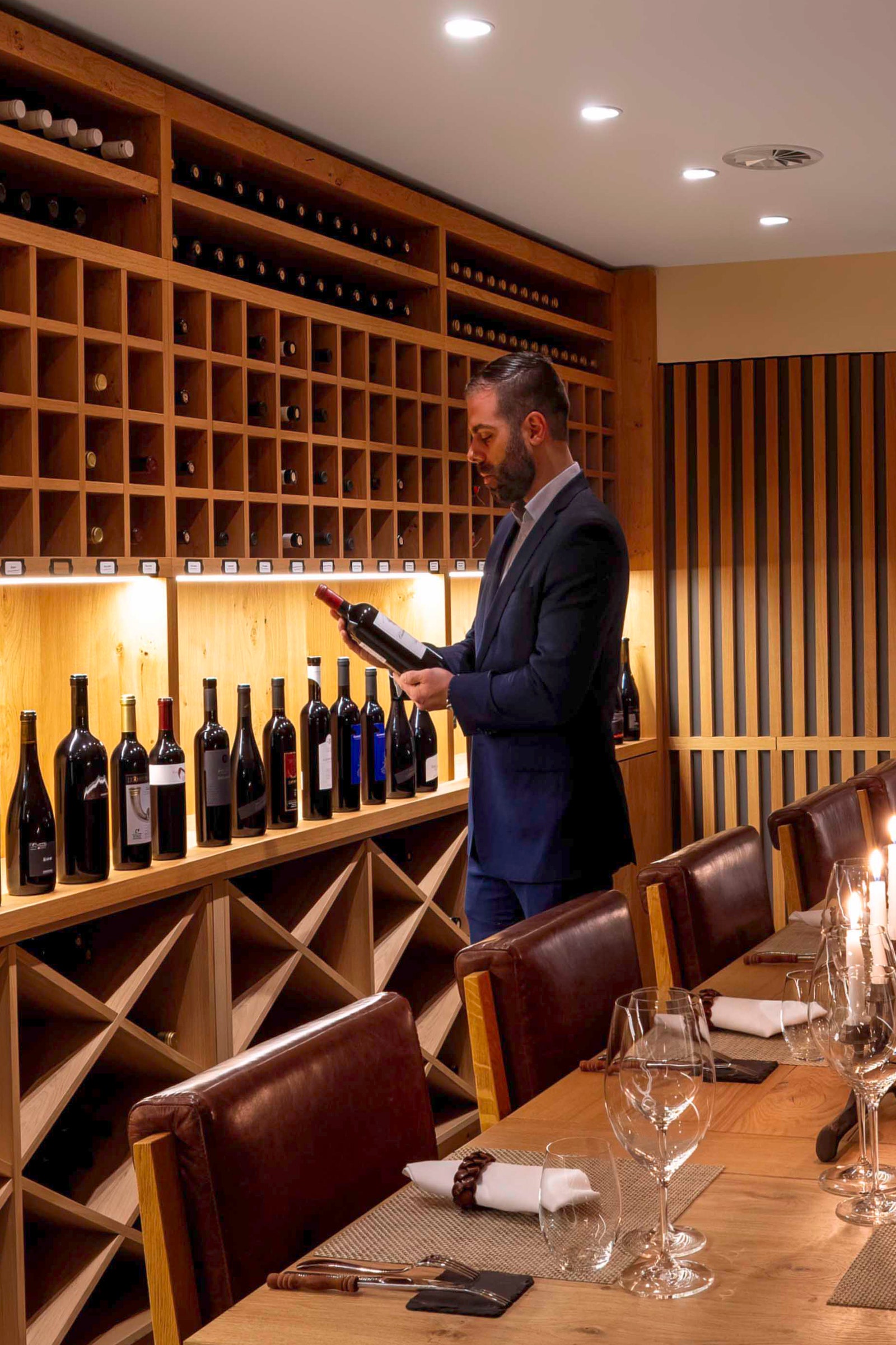 Image may contain Alcohol Beverage Liquor Wine Chair Furniture Adult Person Wine Cellar and Cup