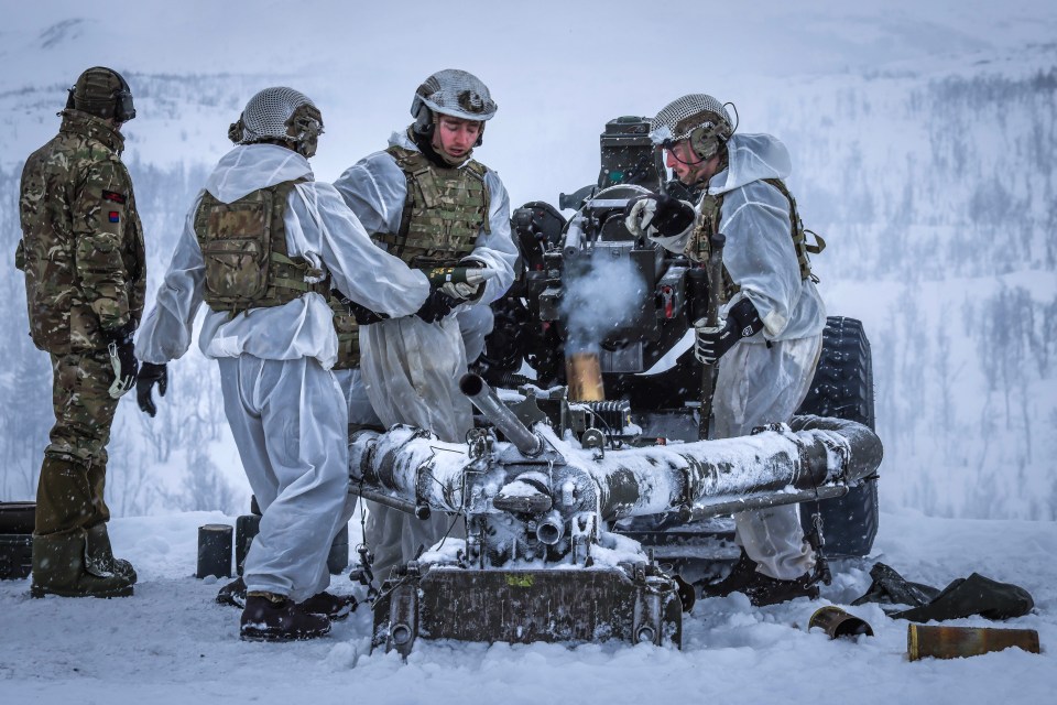 Army Commandos loading a 105MM Howitzer in Norway.