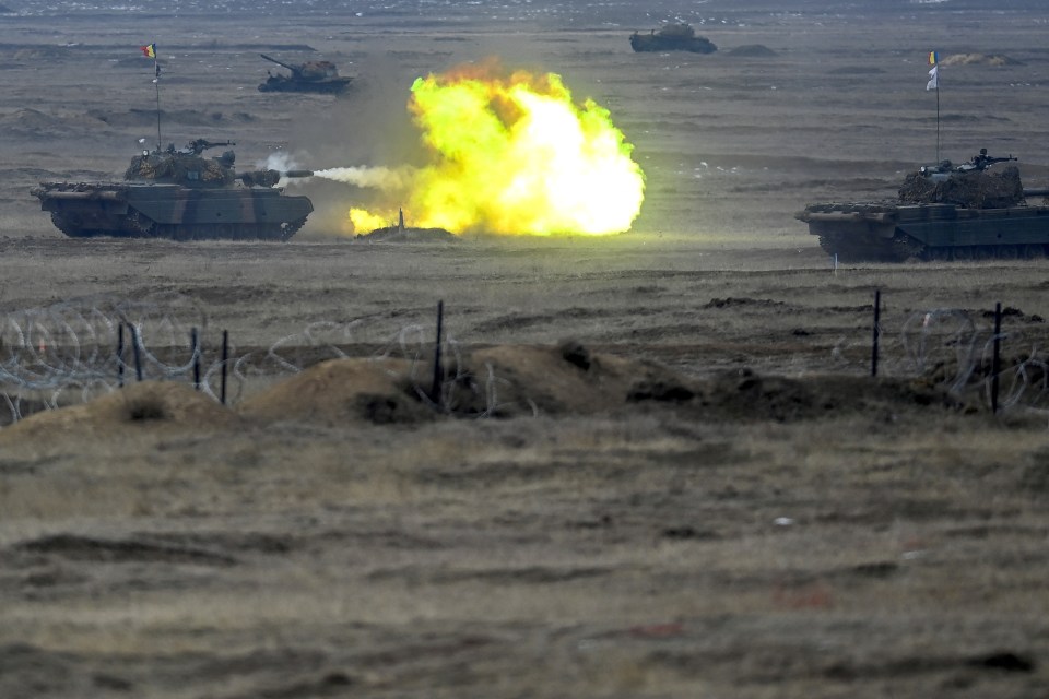 Romanian tank firing during NATO military exercise.