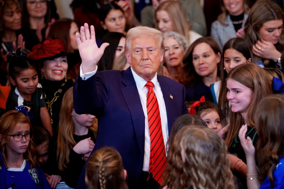 President Trump waving to a crowd of mostly girls.