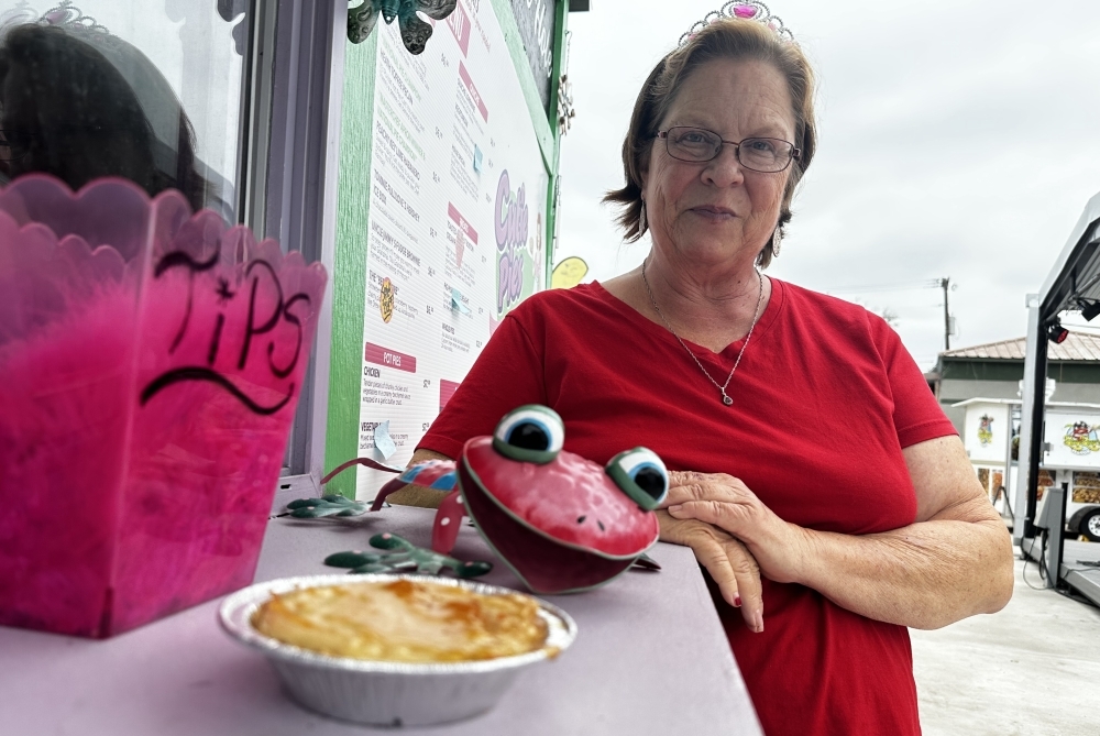 The owner wears a tiara and poses next to one of her pies in a previous interview.