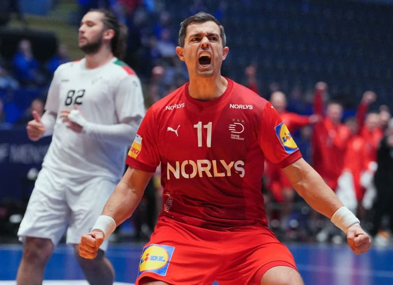 Denmark's Rasmus Lauge celebrates scoring during the IHF World Men's Championship final round, semi-final handball match between Denmark and Portugal at Unity Arena. Soeren Stache/dpa