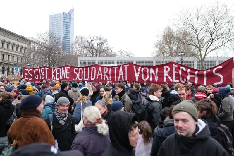 Demonstrators hold a banner that reads "There is no solidarity from the right" in German, during a demonstration in Leipzig's Wilhelm-Leuschner-Platz against a tougher migration policy in Germany. Demonstrators took to the streets across Germany against efforts by the centre-right Christian Democratic Union (CDU) to push through reforms to migration laws in parliament with the support of the far-right Alternative for Germany (AfD). Sebastian Willnow/dpa