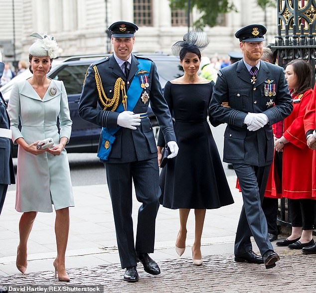 Prince Harry says his brother 'recoiled' from Meghan's hug during their first meeting at Kensington Palace. The two couples pictured in July 2018