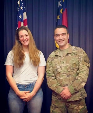 Capt. Rebecca Lobach and now-Capt. Bilal Kordab pose for a photo after Lobach took her oath of enlistment into the North Carolina Army National Guard in Raleigh, North Carolina, in December 2018.