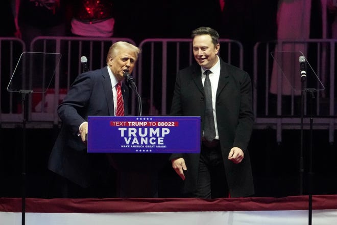 Elon Musk and Donald Trump are pictured speaking at the 'Make America Great Again Victory Rally' at the Capital One Arena in Washington.