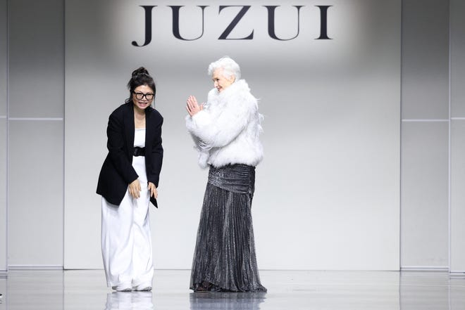 Designer Wang Tao, left, professionally known as Taoray Wang, and Maye Musk, Elon Musk's mother, acknowledge applause after the Juzui fall 2025 collection show during New York Fashion Week, in New York on Feb. 7, 2025.