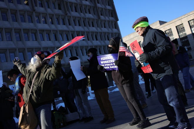 Demonstrators gather outside of the Department of Health and Human Services in Washington, D.C. on February 14, 2025 to support federal workers and protest Elon Musk's Department of Government Efficiency (DOGE) budget cuts and employee firings.