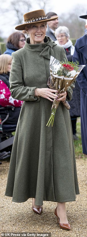Sophie's Claire Mischevani coat, with a funnel neck and bow details, mirrored the silhouette but was paired with Jimmy Choo pumps and a Jane Taylor boater hat