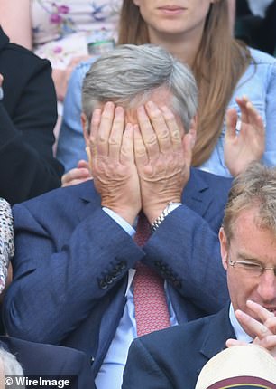 Michael covers his eyes during an intense tennis match at Wimbledon in 2018