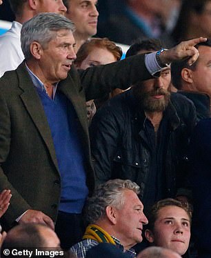 Michael points out action on the pitch at the England v Australia match at the Rugby World Cup  in 2015