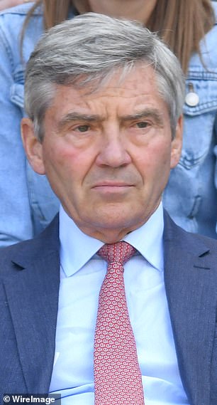 Michael wears a reserved expression at Wimbledon in 2018