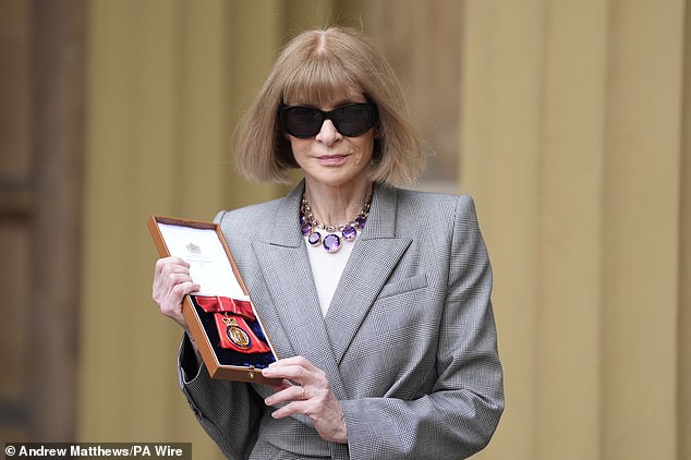 The shades were back in place as Anna left Buckingham Palace while showing off her medal