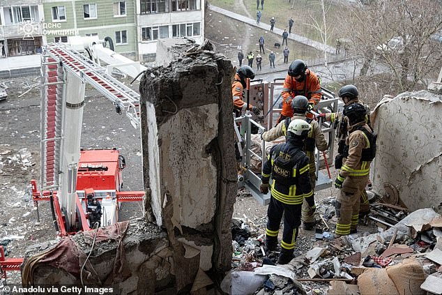 Officials work at the site of destruction after the Russian attack in Sumy, Ukraine on January 30, 2025