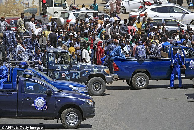 South Sudan slid to the bottom of the index with just eight points (File image of Sudanese rescue teams and security forces gather next to damaged vehicles in Khartoum)