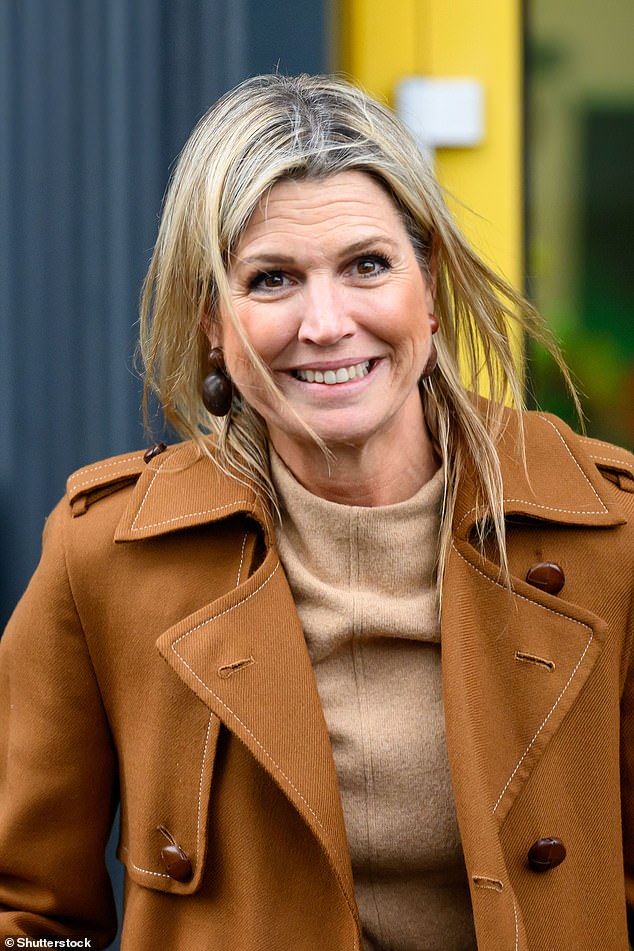 The mother-of-three donned a chic tan trench coat which she paired with an elegant knitted sand-coloured roll neck dress