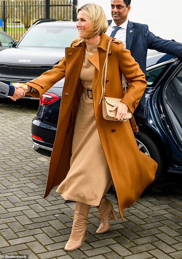 Despite the grey and rainy weather in the town, Maxima stepped out in a strikingly chic all-brown ensemble