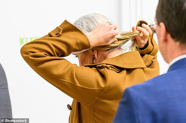 Safety first! Maxima was seen putting her long blonde tresses inside a hairnet for the event on Tuesday